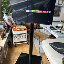 Smart TV and stand. Great for displaying info 