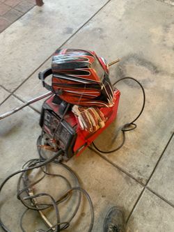 Lincoln Electric MIG Welder with Helmet and Gloves