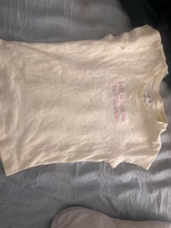 cream-colored embroidered baby tee featuring the phrase "put it on my fiance's tab"