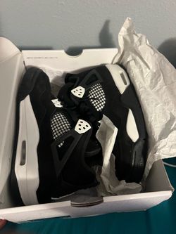 Air Jordan 4 Black and White Sneakers