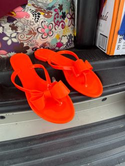 Bright orange bow sandals