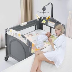 368^ 5 in 1 Baby Crib, Bassinet Beside Sleeper, Pack and Play with Bassinet and Changing Table Portable Travel Baby Playpen with Toys & Music Box, Mat