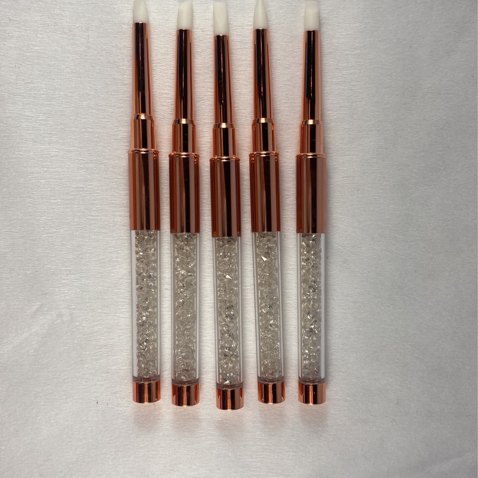 A Set Of High-end Rose Gold Silicone Brushes
