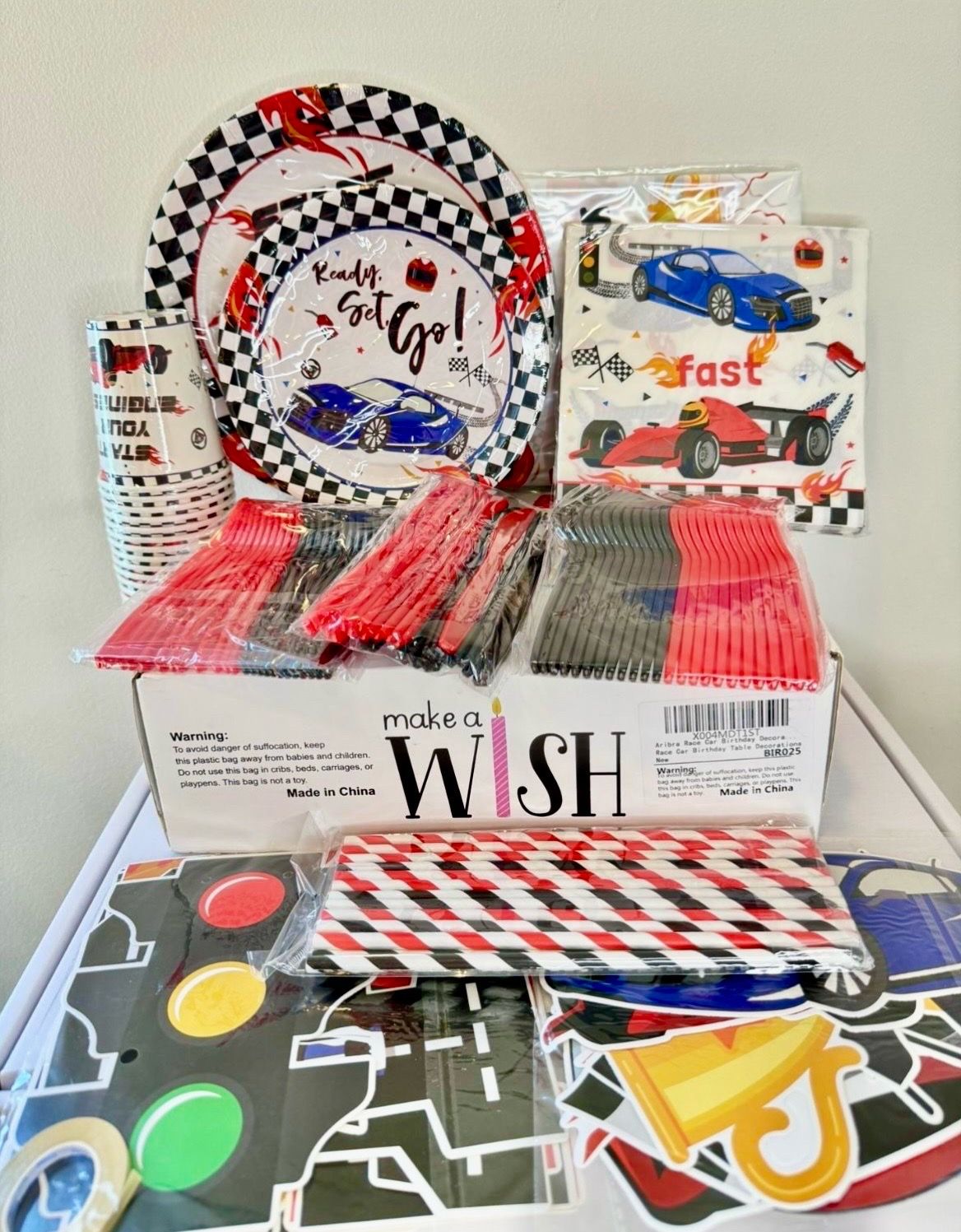 Race Car Birthday Party Decorations for 24 people: Includes: cups, tablecloths, napkins, utensils, plates, straws and decorations.