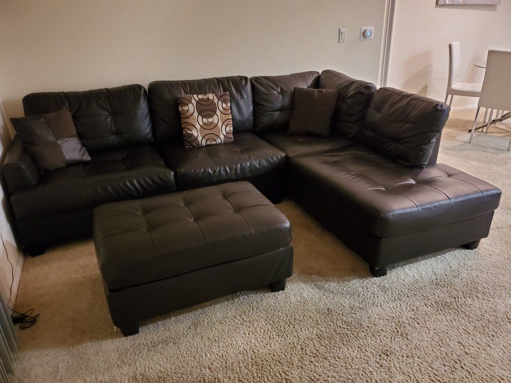 Brown leatherette couch with futon