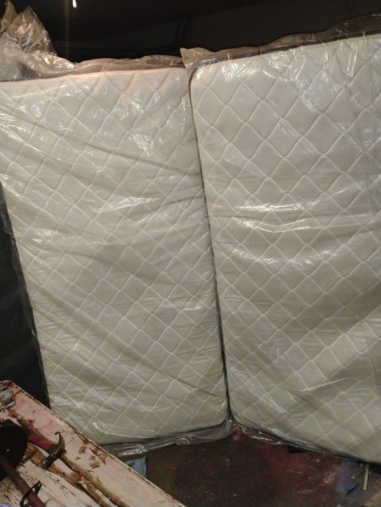 2 Brand New Twin Mattresses And Box Springs