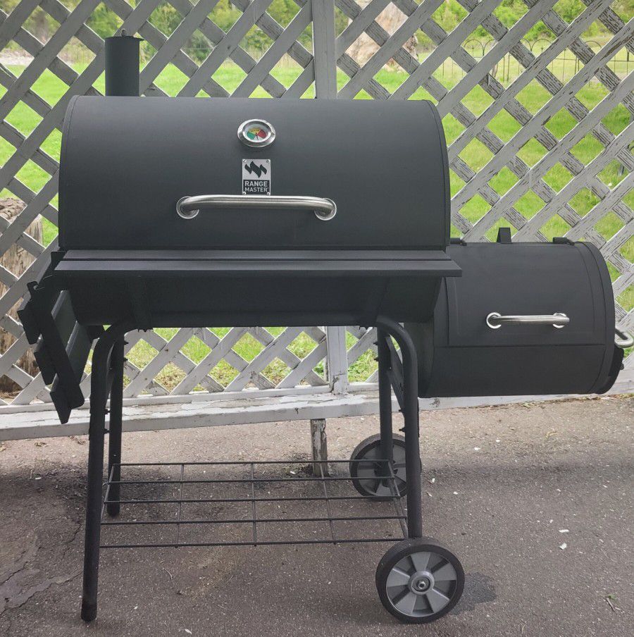 Charcoal grill with offset smoker 
