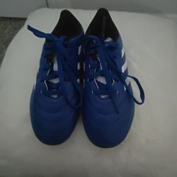 Adidas Goletto VIII youth soccer cleats in royal blue with white accents. 