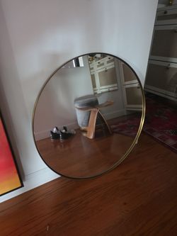 Gold round mirror
