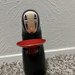 No Face Coin Bank