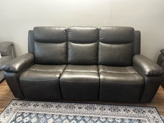 Genuine leather power reclining sofa with power headrest