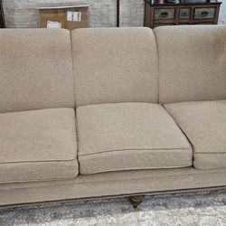 Beautiful 8-foot upholstered sofa rolled arms brown wood feet