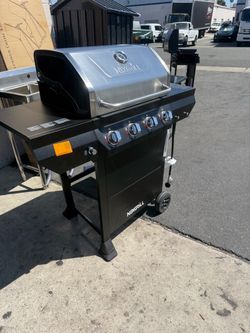 4-Burner Propane Gas Grill in Black with Stainless Steel Main Lid