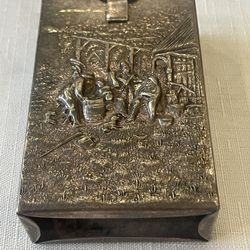 Silver-plated repoussé cigarette case with a village scene. Made in Denmark