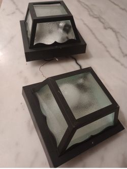black one-light flush mount outdoor ceiling fixture featuring textured glass panels