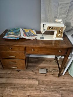 Singer sewing machine needs work 85.00