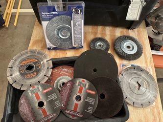 Makita Angle Grinder with assorted wheels and case