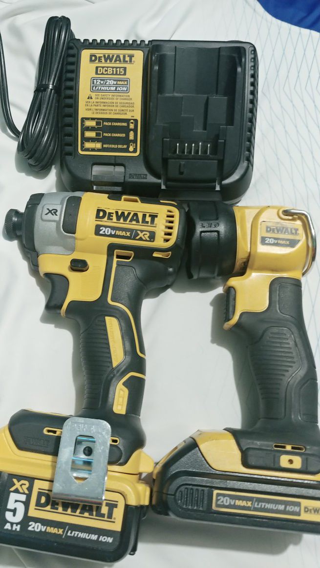 Dewalt impact drill batery 5.0 ah XR .led light 20v.and charger.good condition .