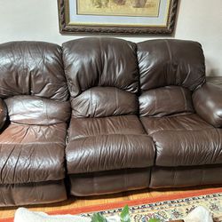 Brown Leather Reclining Sofa.   