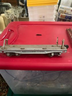 vintage Lionel 811 flat car from the prewar era.