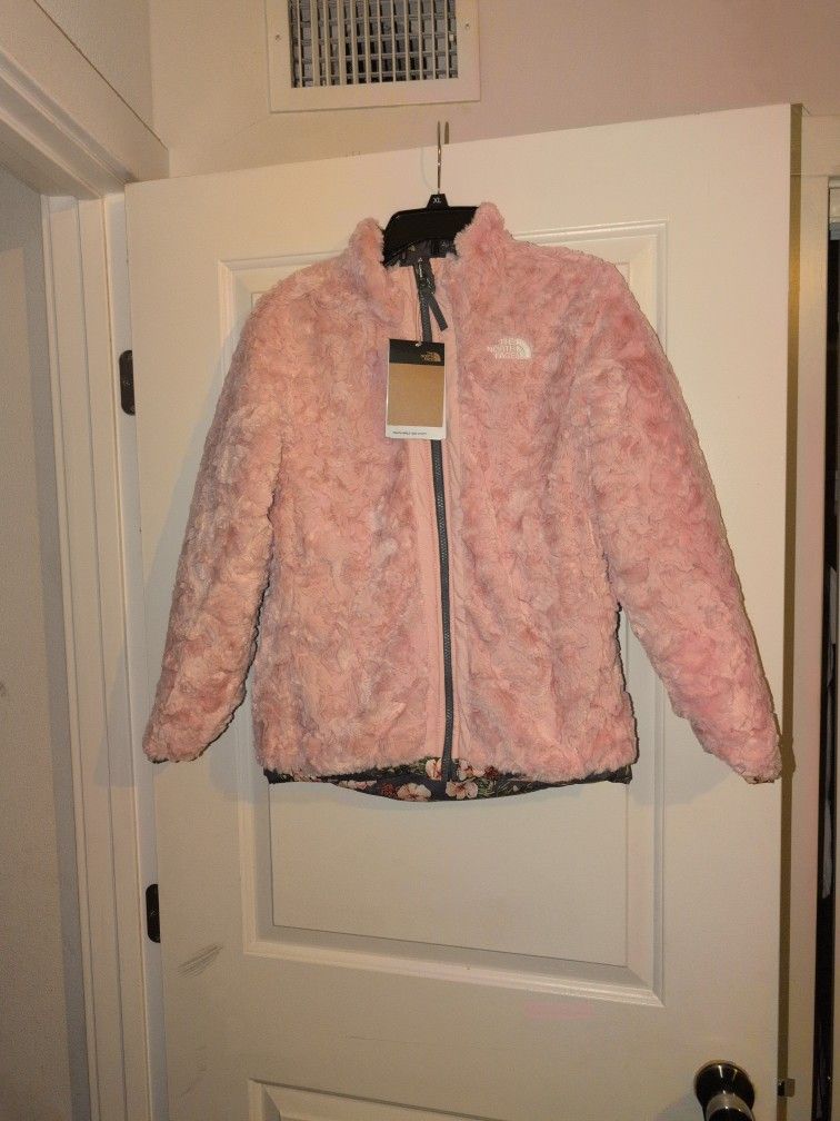 This is a North Face reversible coat, size 14/16