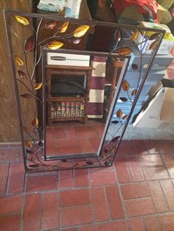 Mirror with colored leaves great for any living room