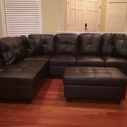 Brown leather sectional couch and ottoman