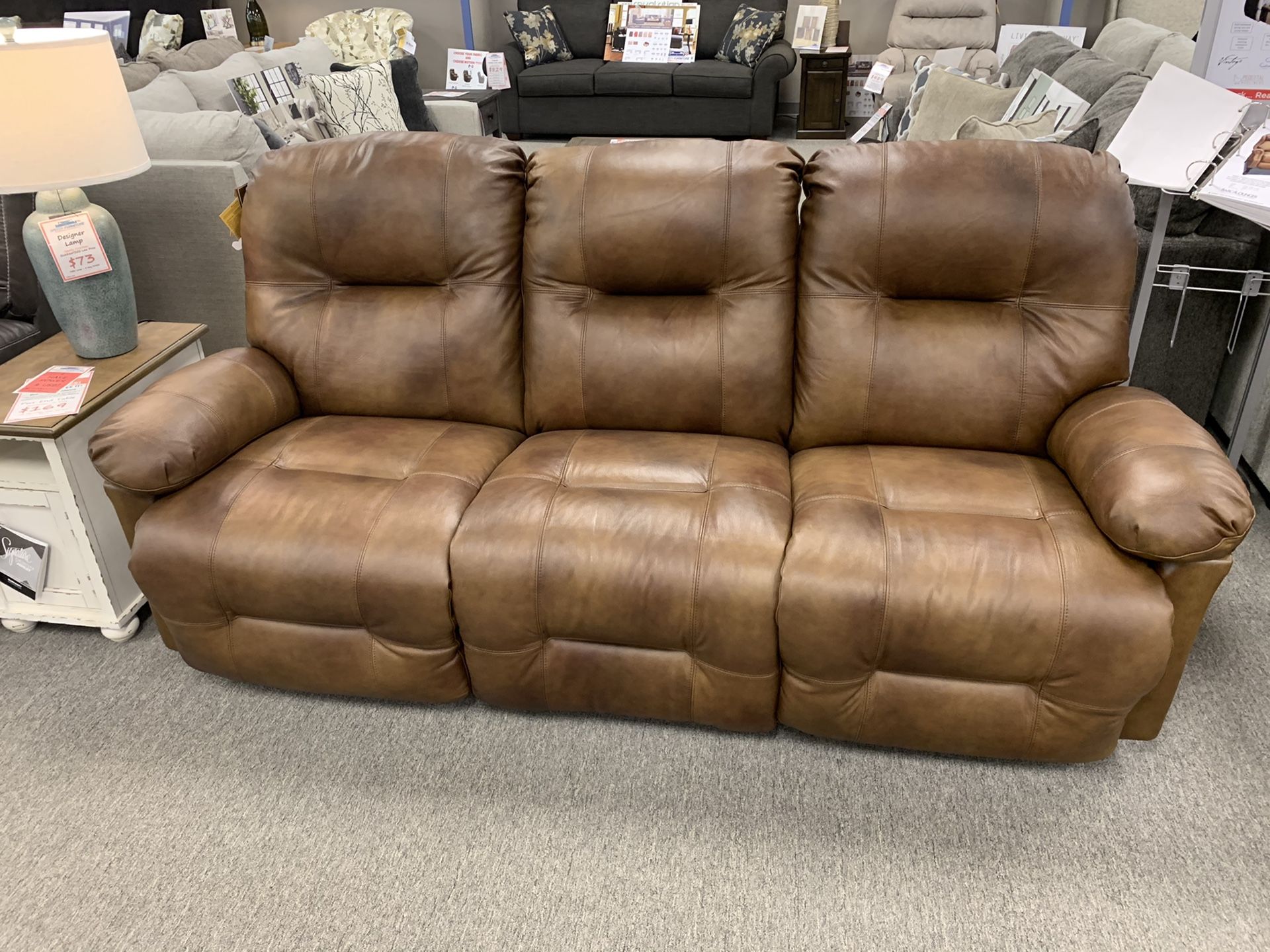 Custom made leather reclining sofa! Floor model clearance! Take home today!