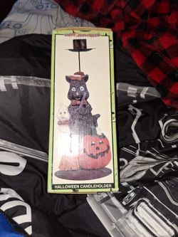 Halloween candle holder a black cat, a ghost, and a jack-o'-lantern.