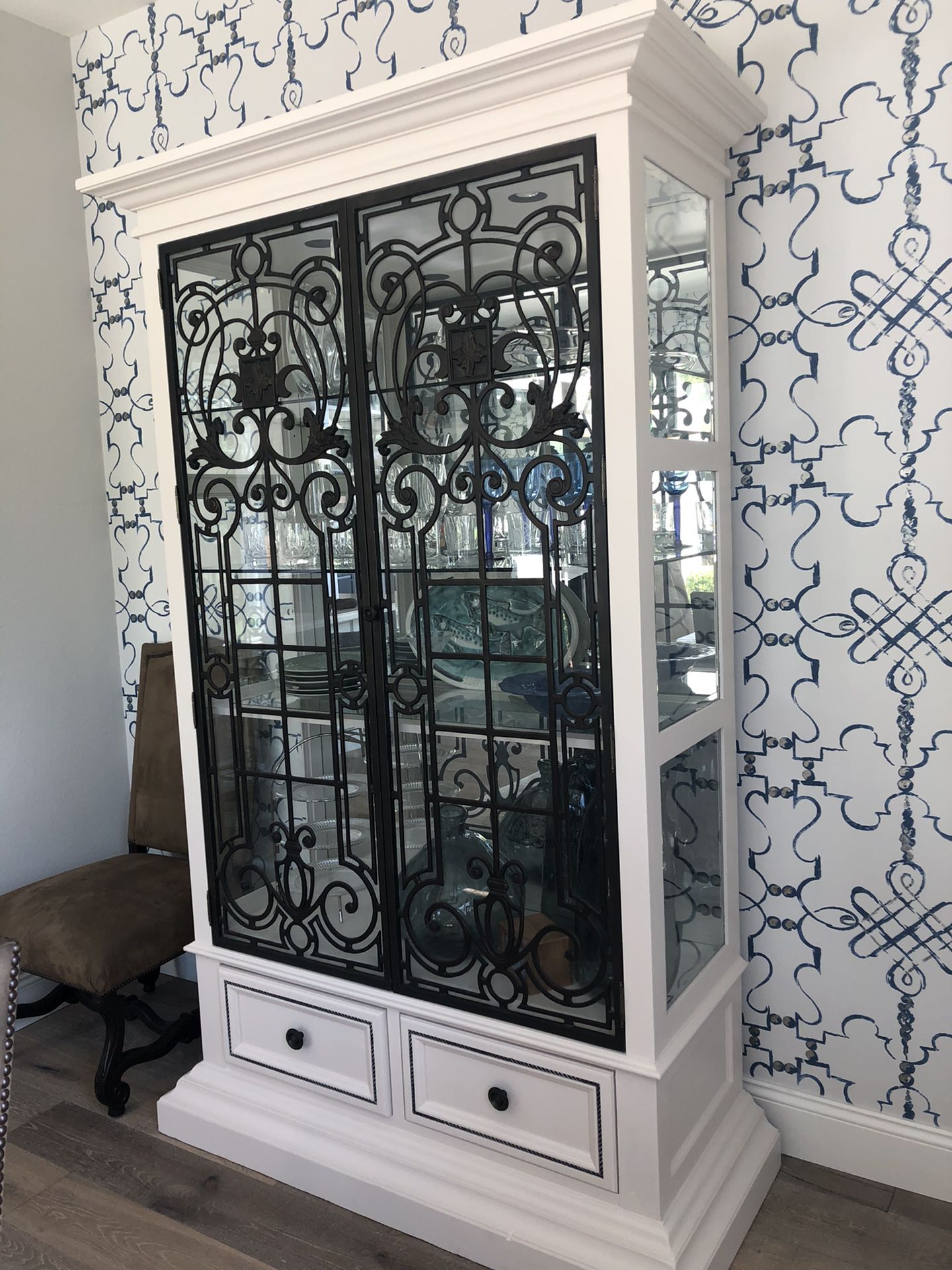 High end china cabinet with lights, mirrored back, drawers and plate grooves.