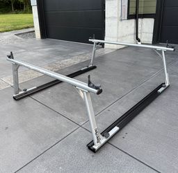 Thule TracRac SR Sliding Truck Bed Ladder Rack - 1,250 lbs $1549+ tax online   It's been used for a couple years, but the bottom rail I did  power coa