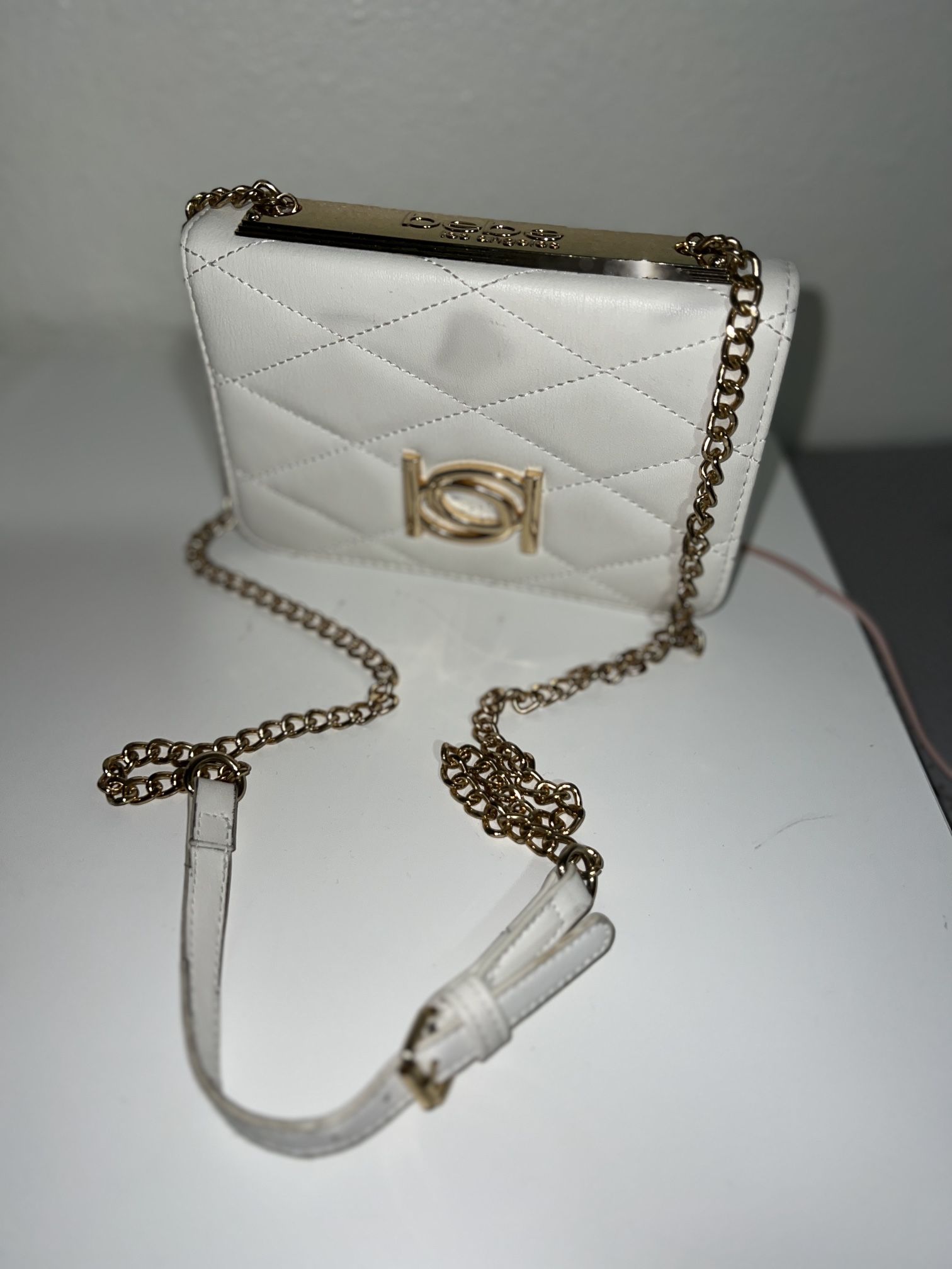 white BEBE cross body bag