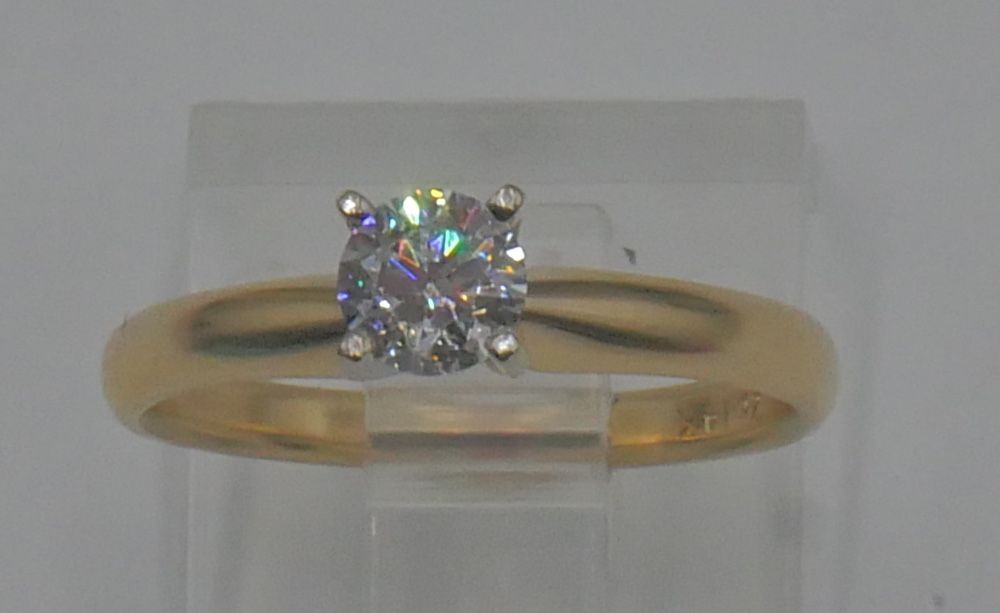 14KT YELLOW GOLD RING SIZE 5 2.1 GRAMS 0.33PTS ROUND DIAMOND SI2 G COLOR. NOTE ONE INCLUSION OFF CENTER. 879540-1.