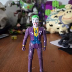 1989 Toy Biz DC Comics Batman The Joker action figure with a squirting orchid feature. 