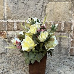 Celebrating Home floral arrangement of Roses on wooded pot