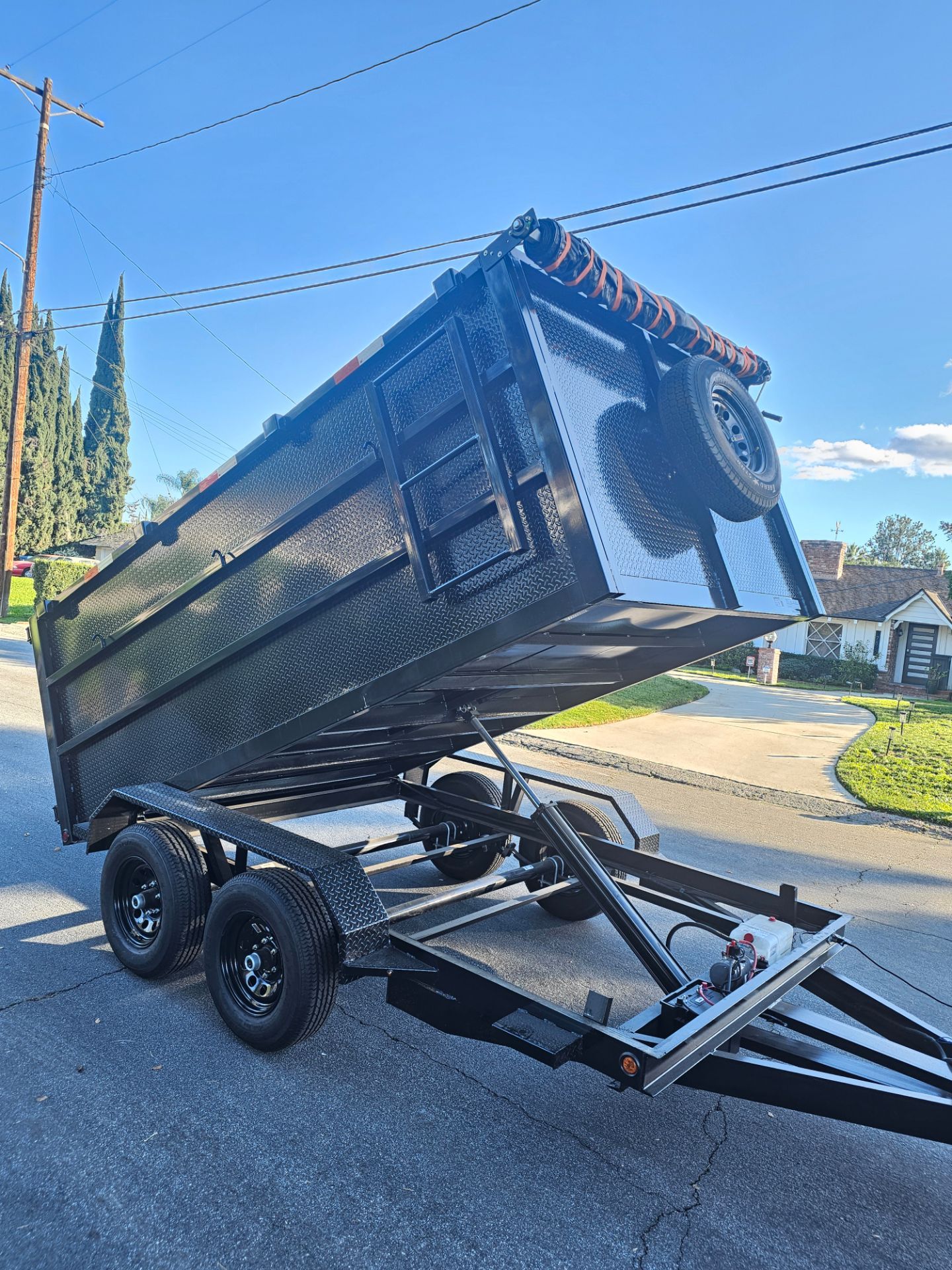 NEW DUMP TRAILER 12x8x4 12000 LBS
ROLLING TARP--SPARE TIRE,ELECTRIC BRAKES,HYDRAULIC SYSTEM,REMOTE CONTROL,IDEAL FOR HAULING, DEMOLITION, TRASH ETC,FO