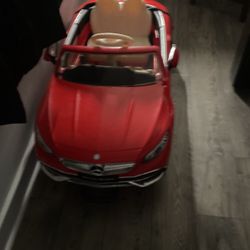 Red Mercedes-Benz child’s car