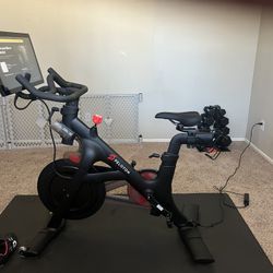 2023 Peloton Bike In Excellent Condition. Comes With Size 6 Women’s Shoes In Great Condition 