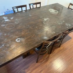 Wooden dining table with 6 chairs