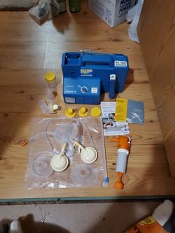 blue Medela Lactina Select hospital-grade breast pump with a speed control knob