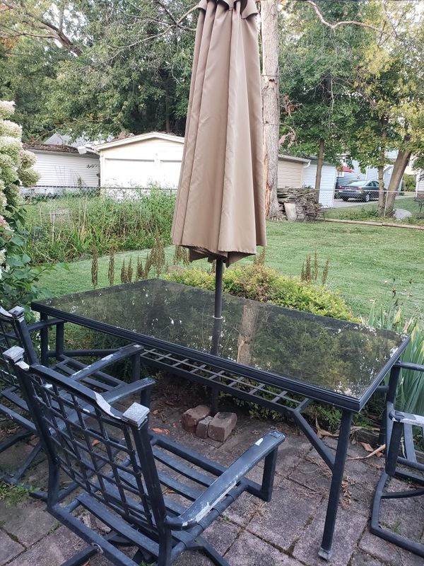Patio table, umbrella, 8 chairs with swivel and lean for ...