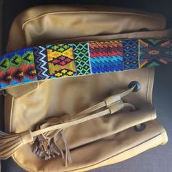 leather crossbody with handbeaded strap