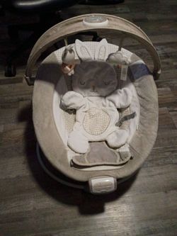 Bouncer with lights and vibrates