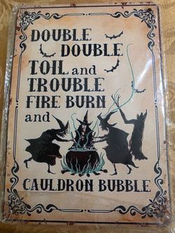 Witches brew metal sign.