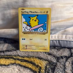 Surfing Pikachu Pokémon card from the XY Evolutions set (card number 111/108). 
