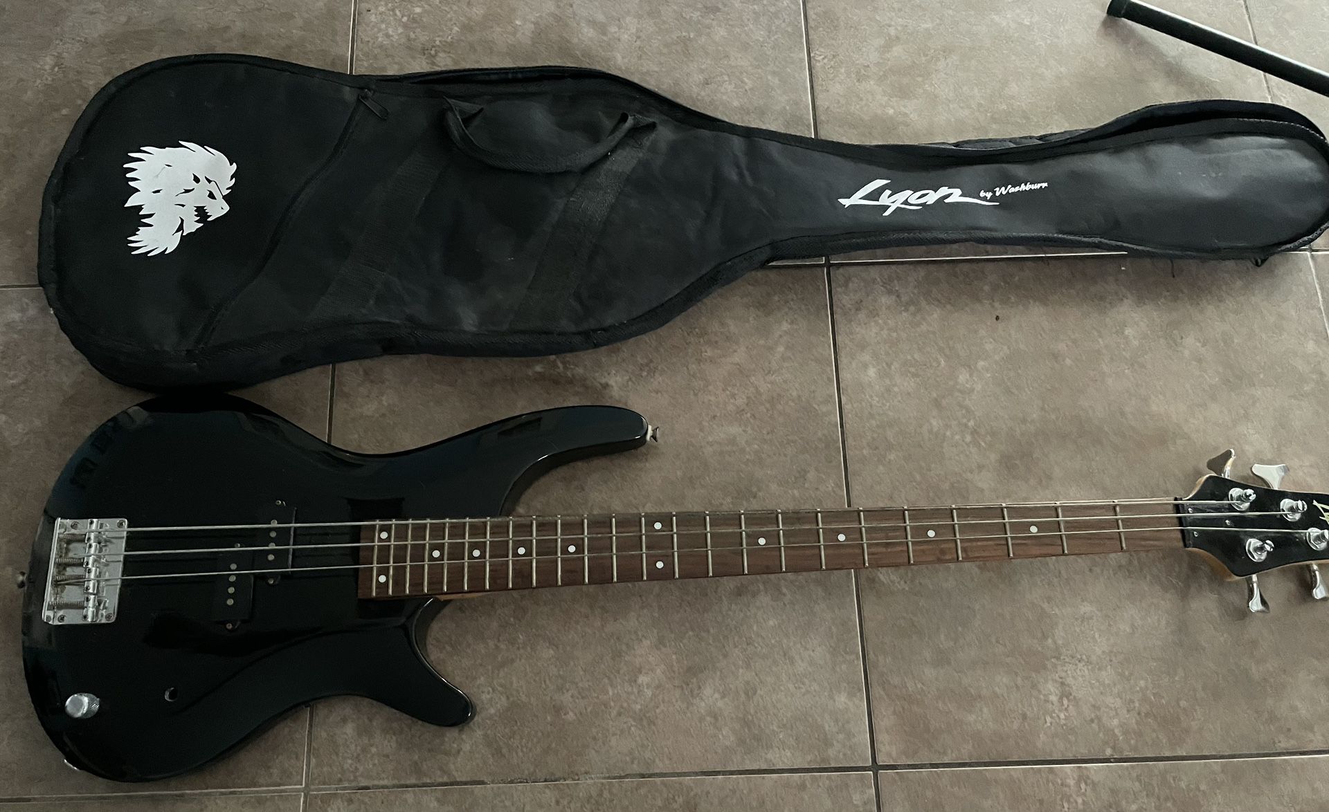 Lyon by Washburn 4 String Electric Bass Guitar in Black with case and stand. As is. See photos. Great overall condition