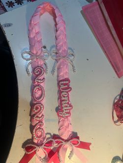 Graduation leis, and cap toppers