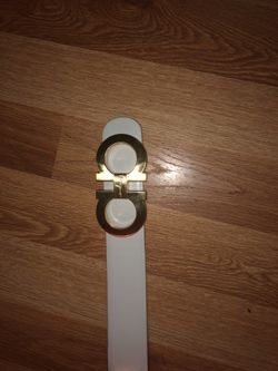 White and gold feragamo belt