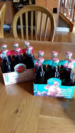 (12) Coca Cola vintage Christmas bottles