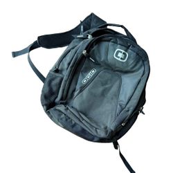 OGIO backpack with multiple zip pockets. Padded shoulder straps for comfort. Durable fabric and reinforced seams. Front logo accent and organized comp